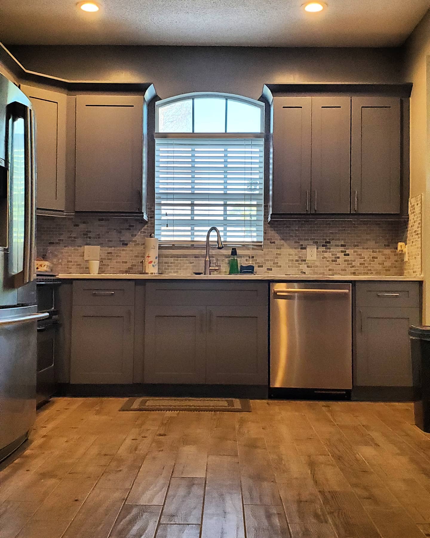 Kitchen remodel with marble-look countertops and custom cabinets